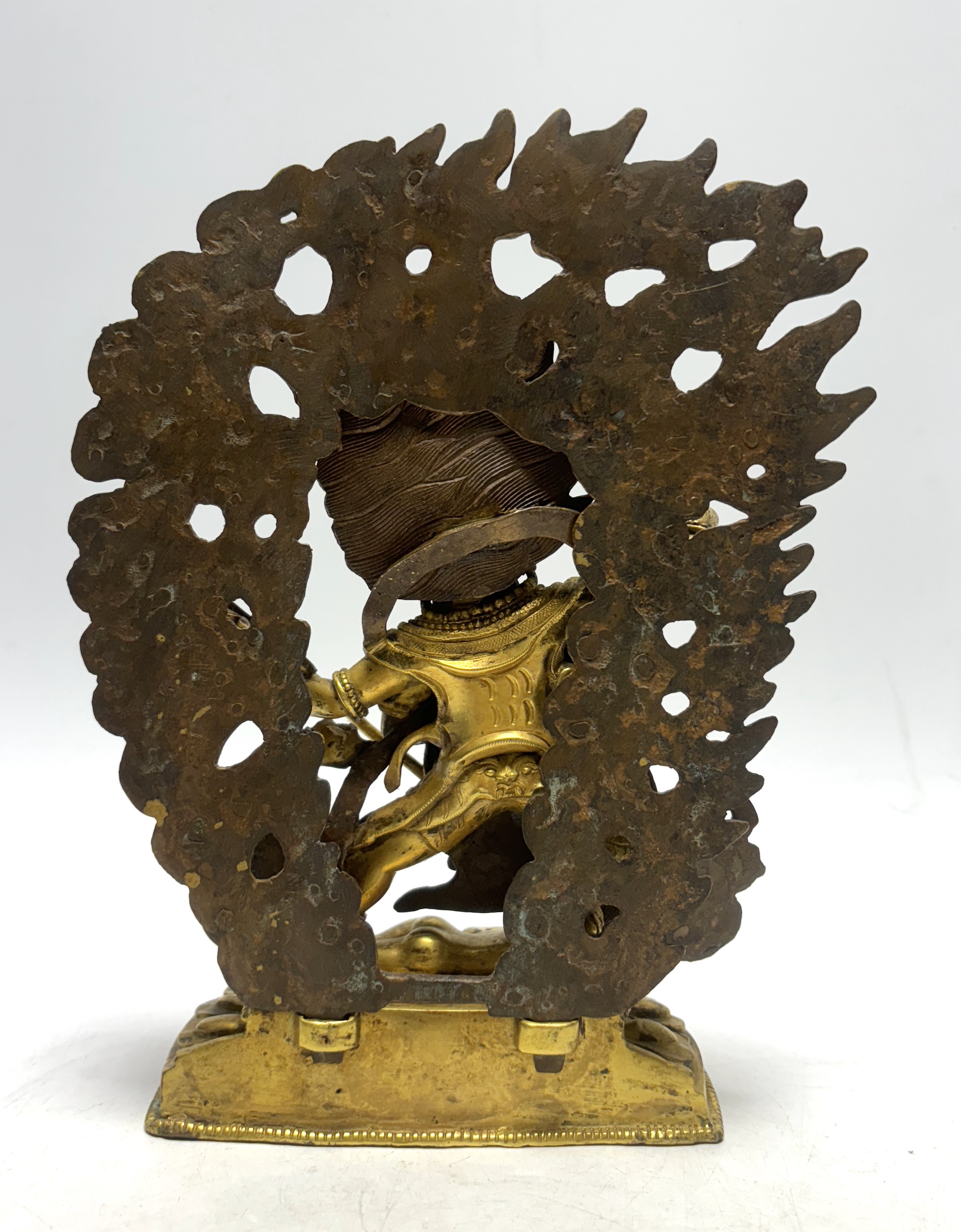 A Sino Tibetan gilt bronze figure of Mahakala, 23cm high